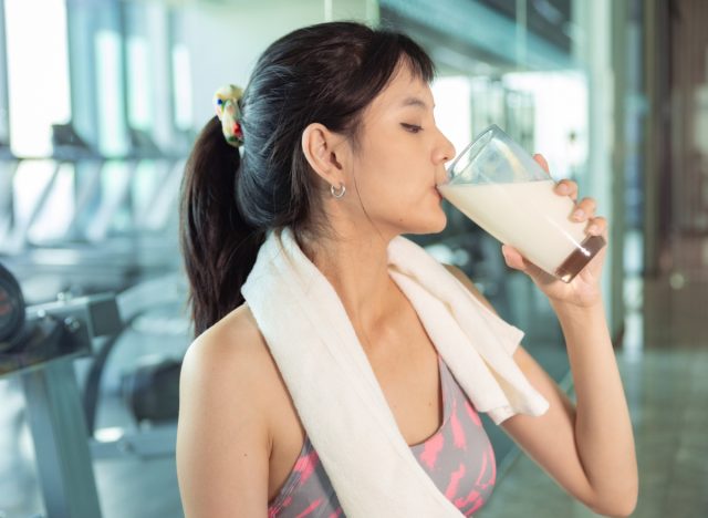 woman drinking milk after workout